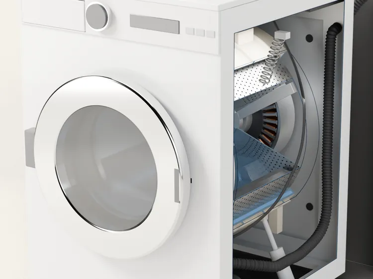 The washer cut open at the side: water in the tub, and the drum inside it standing still.